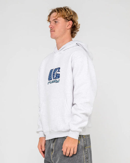 Person wearing a white hoodie with a logo on a plain background