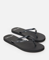 Black flip-flops with 'Rip Curl' branding on a white background