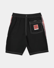 Black boardshort with maori design on the side 