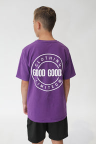 Person wearing a purple 'Good Good Limited' t-shirt on a white background