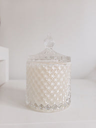 Decorative glass jar with a textured surface on a white background