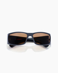 Sunglasses with dark lenses on a white background