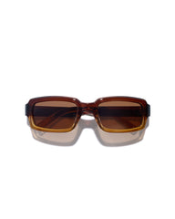 Sunglasses with brown lenses and black frames on a white background