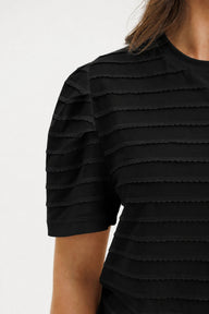 Black textured dress with quarter sleeves on a white background