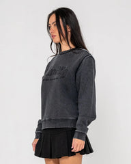 Woman wearing a dark gray sweatshirt with text on a white background