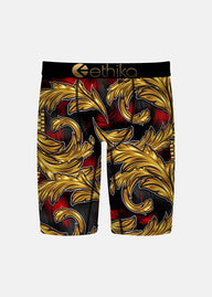 Gold and red patterned shorts with 'ethika' branding on a white background