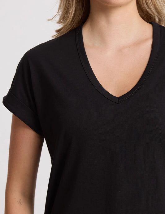 Black V-neck t-shirt worn by a person on a light gray background
