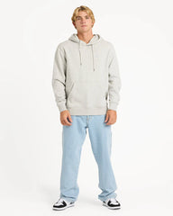 Person wearing a light gray hoodie and light blue jeans on a white background
