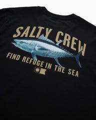 Close-up of a black T-shirt showing a large graphic print of a blue tuna fish with the words 'SALTY CREW' and 'FIND REFUGE IN THE SEA' in tan lettering.