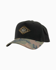 Black cap with camouflage brim and Salty Crew logo on a white background
