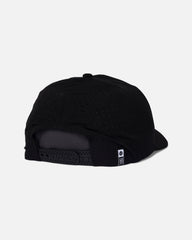 Black cap with a textured back on a light gray background