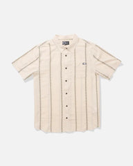 A short-sleeve button-up shirt in cream with vertical tan stripes, laid flat against a light gray background.