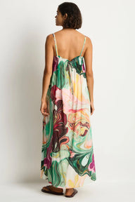 Woman wearing a colorful dress with a white background