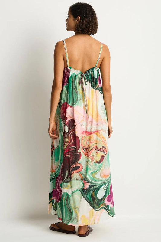 Woman wearing a colorful dress with a white background