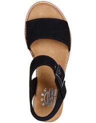 Black sandal with a suede sole on a white background