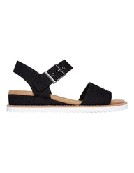 Black sandal with a suede sole on a white background