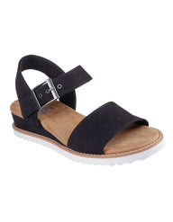 Black sandal with a suede sole on a white background