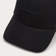 Black cap with a logo on a light gray background