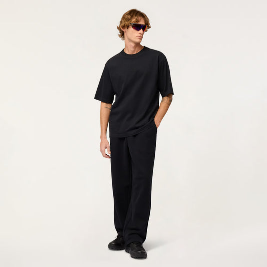 Person wearing a black outfit on a white background
