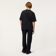 Person wearing a black t-shirt and pants on a white background