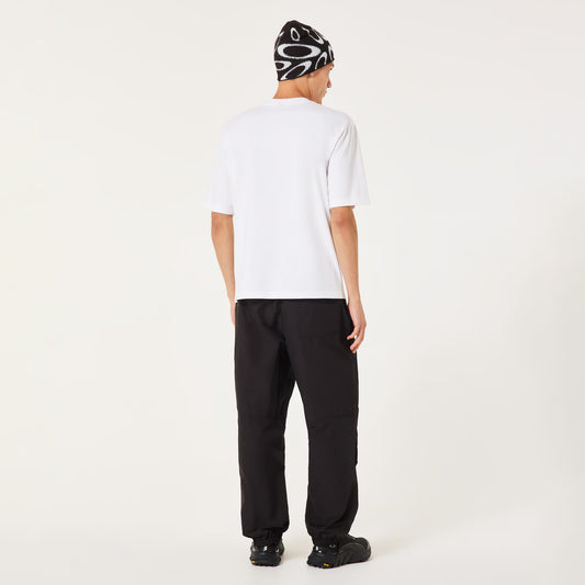 Person wearing a white t-shirt and black pants on a white background