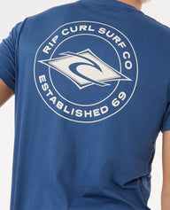 Blue t-shirt with Rip Curl Surf Co logo on the back