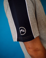 Gray  & Navy shorts Sleeve with a logo on a blue background