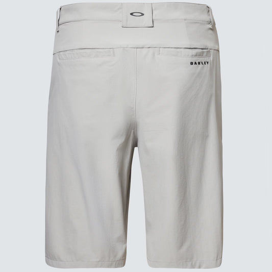 Light gray shorts with brand logo on a light gray background