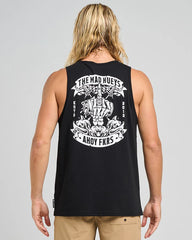 Man wearing a black tank top with a logo on a gray background