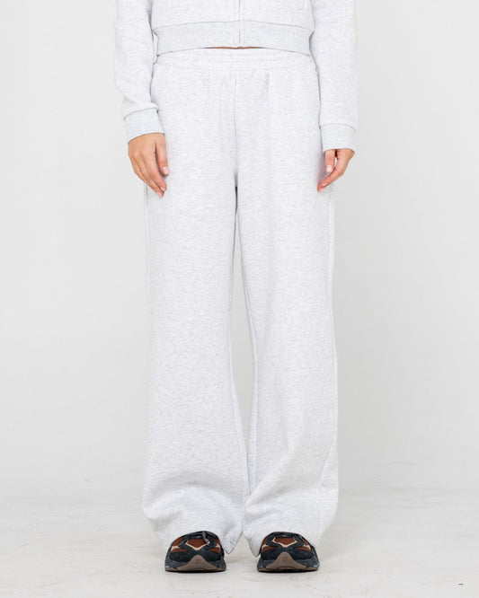 White pants worn by a person on a white background
