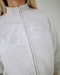 Gray zip-up hoodie with white branding on a plain background