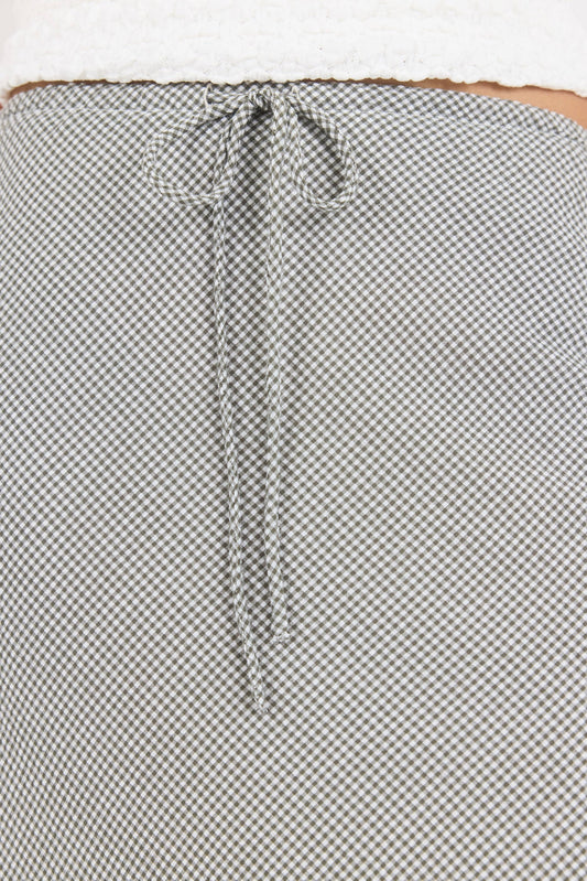 Close-up of a textured fabric with a patterned edge.