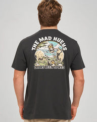 A man viewed from behind wearing a dark charcoal gray t-shirt with a large graphic print on the back. The graphic features the text 'THE MAD HUEYS DRINKS BEEN SPIKED' in white, surrounding an illustration of a bear, a dog, a beer mug, and a cocktail glass.