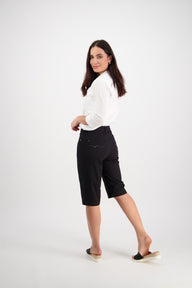Woman wearing Vassalli Black Straight Leg Poplin Short with white shirt and white background