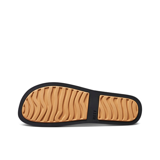 Close-up of a sandal sole with visible brand name on a white background