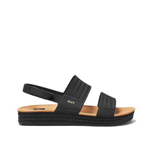 Black sandal with woven design on a white background