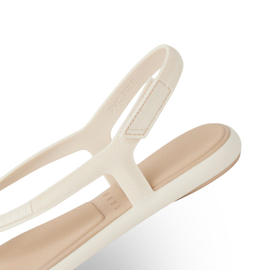 Beige sandal with a strap on a white background