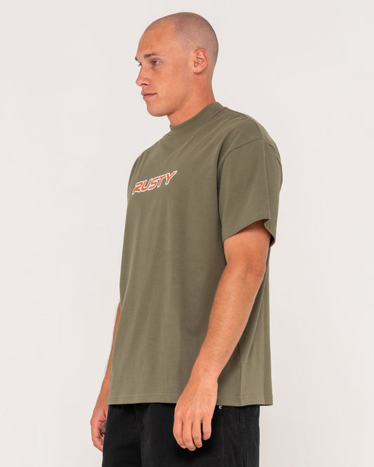 Man wearing a green t-shirt with a logo on a white background