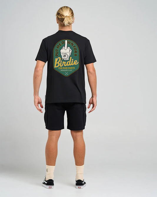 Person wearing a black t-shirt with a logo on the back against a gray background