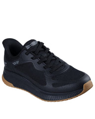 Black athletic shoe with brown sole on a white background