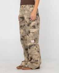 Camouflage pants worn by a person on a white background