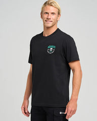 Man wearing a black t-shirt with a logo on a gray background