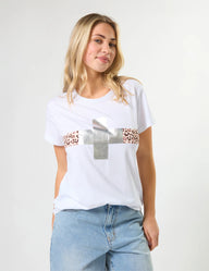 Woman wearing a white t-shirt with a graphic design on a plain background