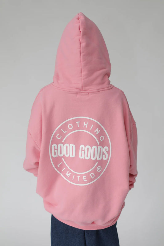 Pink hoodie with 'Good Goods Limited' logo on the back against a gray background