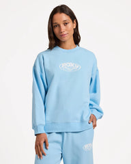 Person wearing a light blue sweatshirt with a logo on a white background