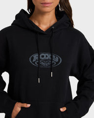 Person wearing a black hoodie with a logo on a white background