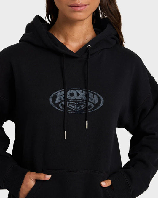 Person wearing a black hoodie with a logo on a white background