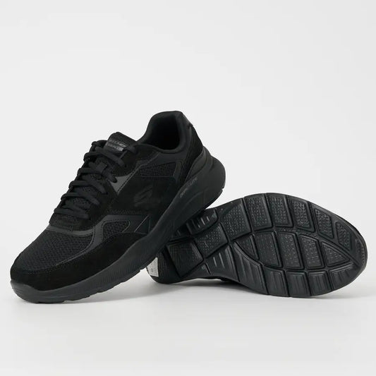 Black running shoes on a light gray background
