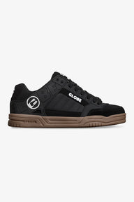 Black and brown sneaker with 'Globe' logo on a white background