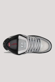 Gray and black sneaker with visible brand logo on a light gray background